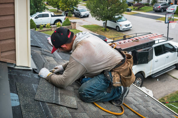 Professional Roof Replacement technician working in Russellville, AL